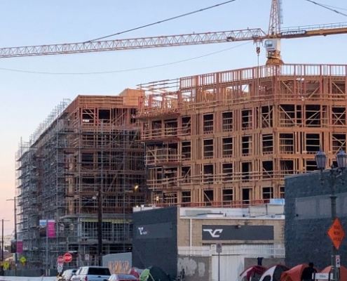 image of tent encampment outside a new building construction in Hollywood