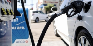 image of a vehicle at a gas station pumping gas