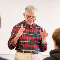 file photo of Michael Dukakis in a classroom