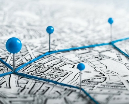 file art of pins on a map