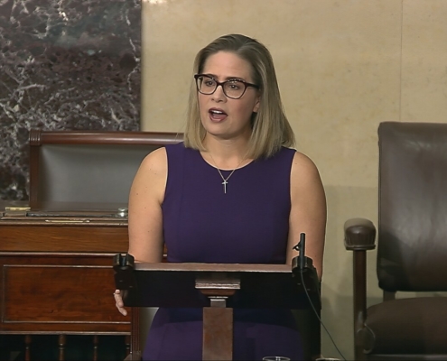 file photo of Sen. Sinema speaking.