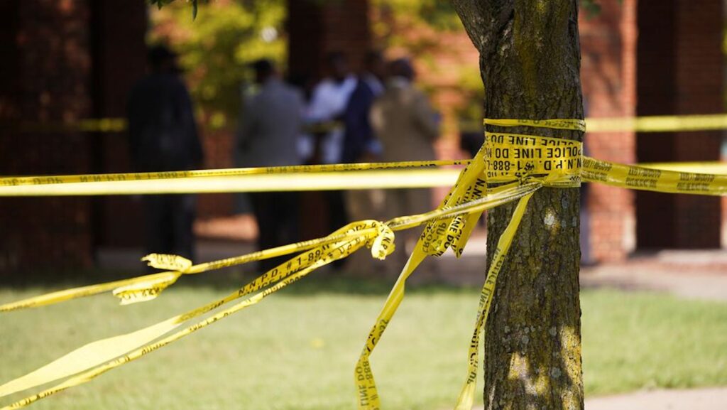 police tape wrapped around tree