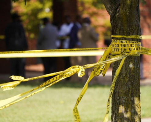 police tape wrapped around tree