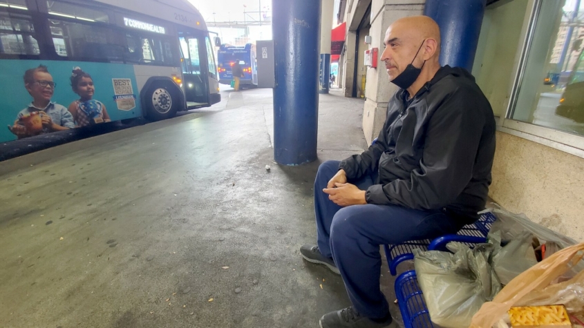 Man waiting at bus stop