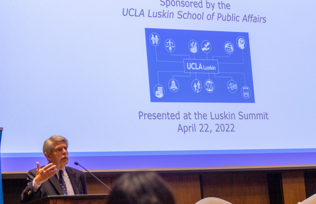 Zev Yaroslavsky gestures in front of project screen showing opening slide at Luskin Summit event||||chart shows info also found in story|photo of Luskin Summit closing day speakers|Two men, Phil Brock and Zev Yaroslavsky, chat|Zev Yaroslavsky listens as Phillip Palmer asks a question|News anchor Phillip Palmer of ABC7 gestures at UCLA event|Zev Yaroslavsky smiles during UCLA event|Dean Gary Segura at podium welcomes attendees