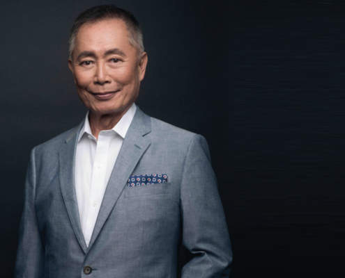 Man in gray suit with white shirt