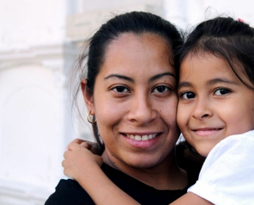 Woman holding little girl
