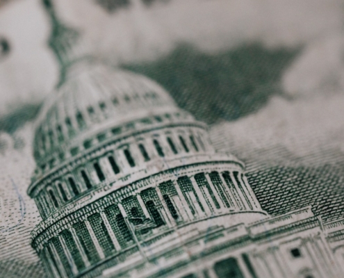 closeup of government capitol building on U.S. currency