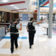 two school police officers in campus cafeteria