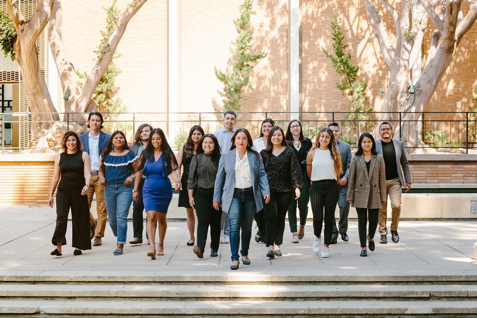 image of several people lined up in three rows and walking toward the camera|image of several people lined up in three rows and walking toward the camera