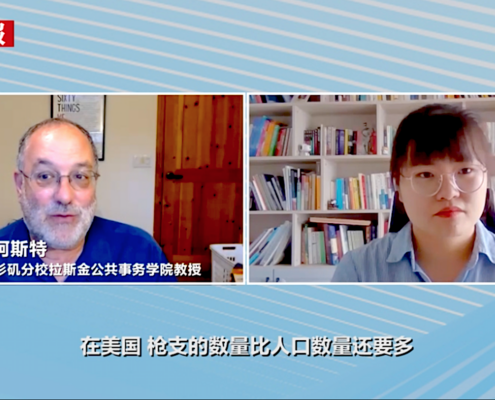 Video screenshot of news interview with man on left, woman on right