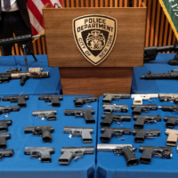 guns arrayed on table