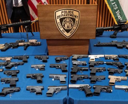 guns arrayed on table