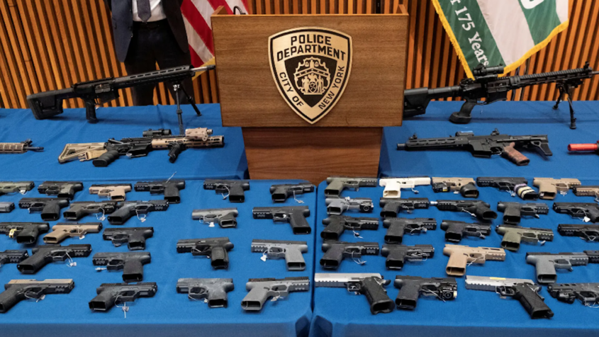 guns arrayed on table