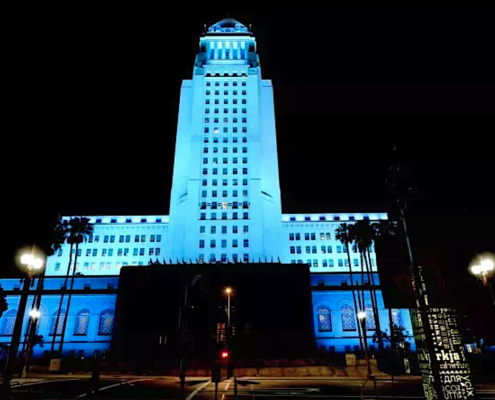 Los Angeles City Hall lit up with blue light