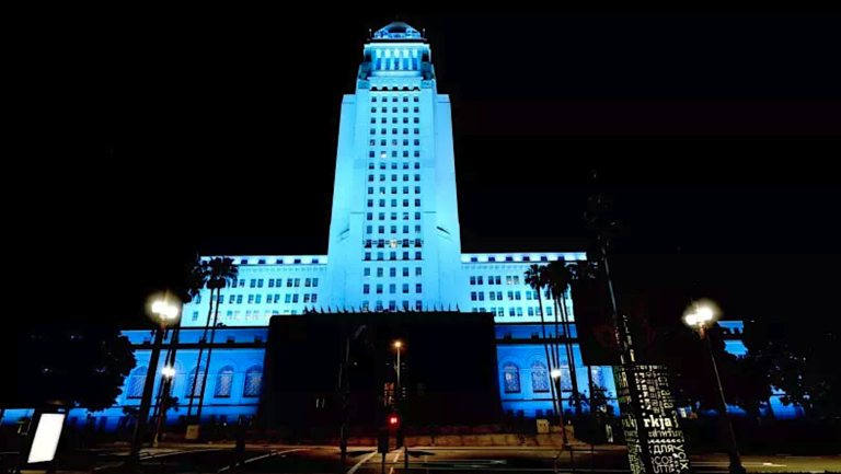 Los Angeles City Hall lit up with blue light
