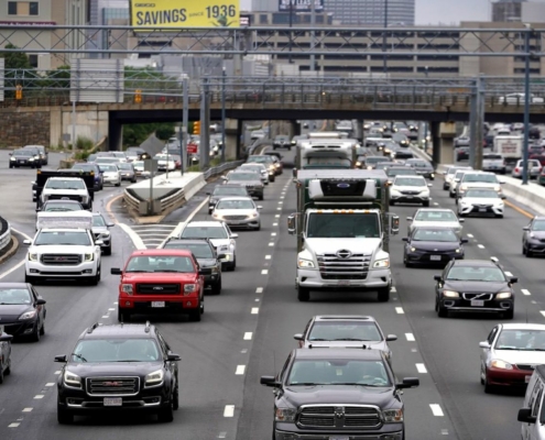 All four lanes of a highway are packed with cars