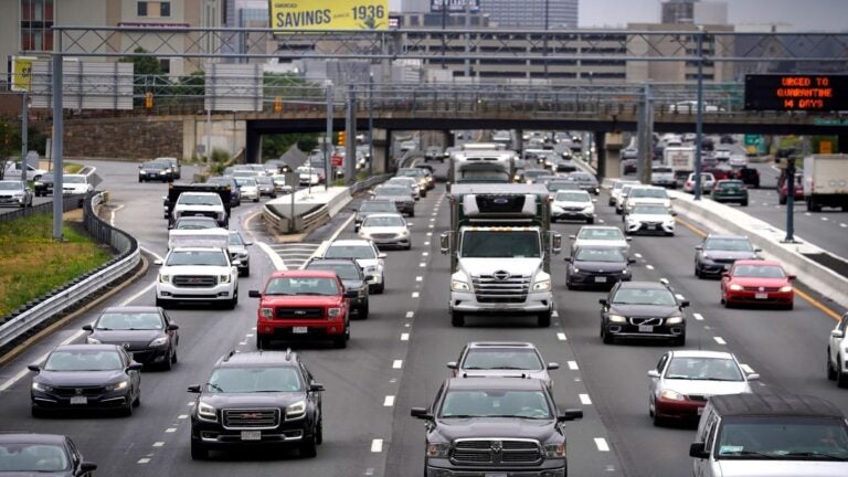All four lanes of a highway are packed with cars