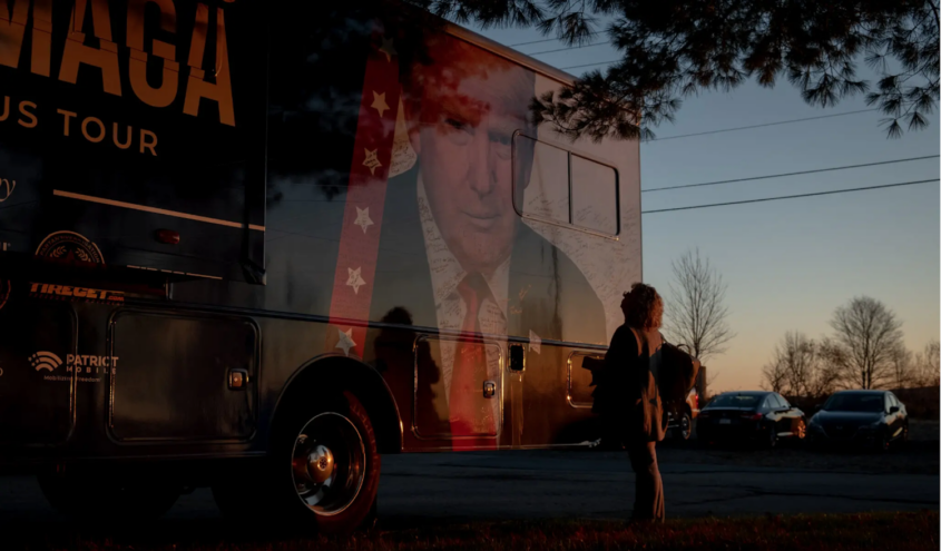 Woman in front of Trump campaign truck