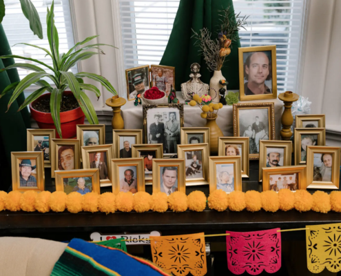 several framed family pictures on a table