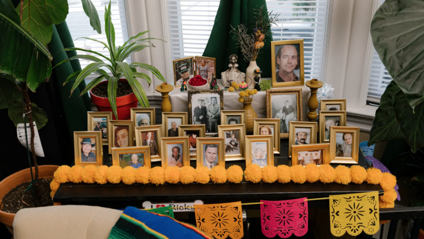 several framed family pictures on a table