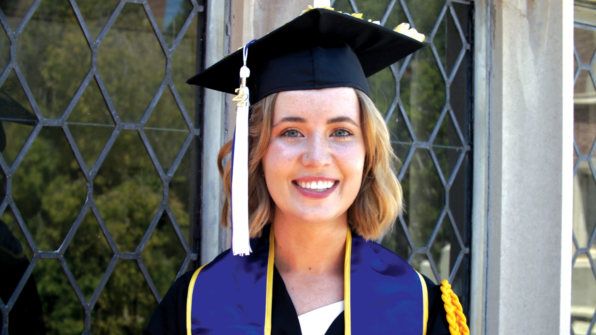 young woman in cap and gown
