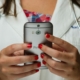 Doctor's hands holding mobile phone