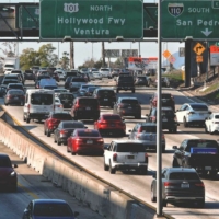 traffic congestion on freeways under freeway signs