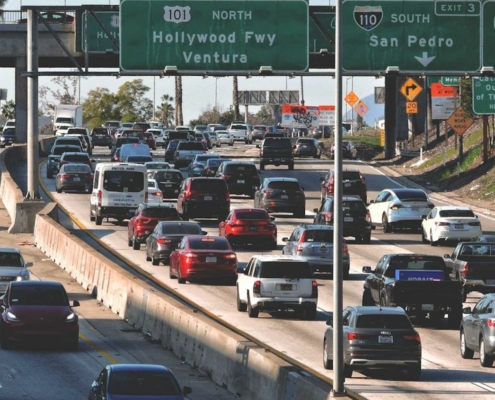 traffic congestion on freeways under freeway signs
