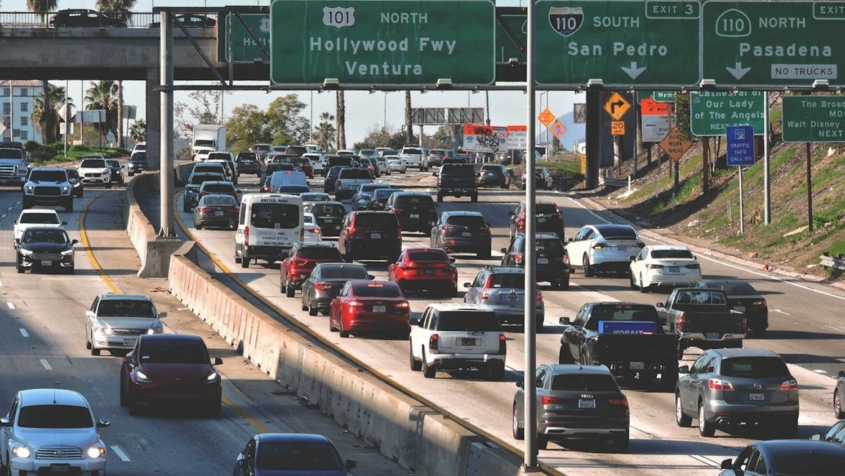 traffic congestion on freeways under freeway signs