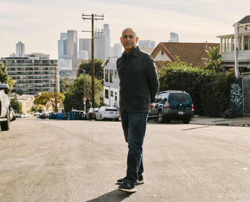 Man standing in residential neighborhood