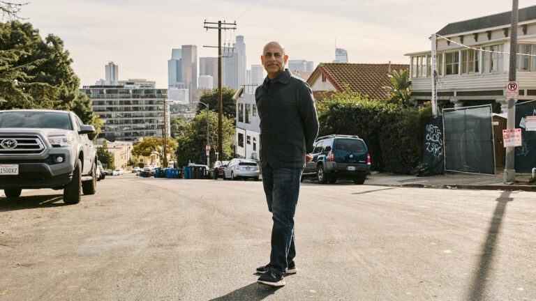 Man standing in residential neighborhood