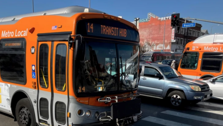 orange bus on city street