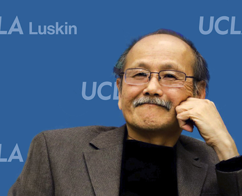 Man in front of blue background