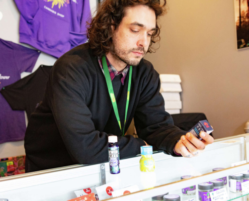 man behind counter of SF pot shop