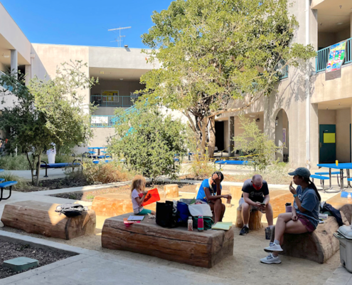 Group sitting in school playground