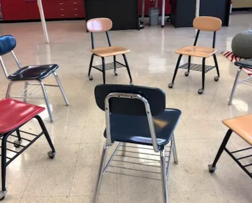 Child-size school chairs in circle