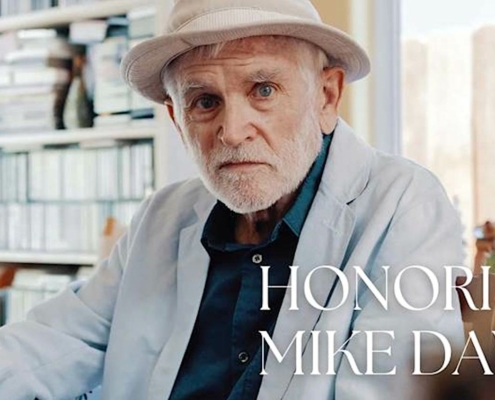man with white beard wearing hat