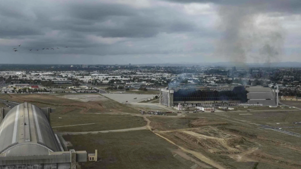 smoke emerging from fire-damaged structure