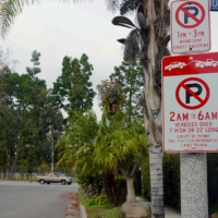 sign showing parking restrictions on residential street