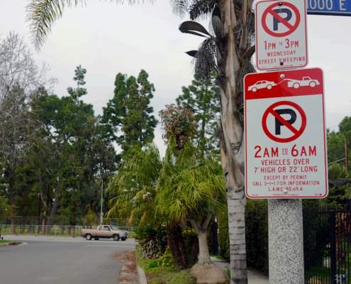 sign showing parking restrictions on residential street