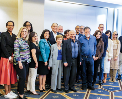 Board members gather after a meeting for a group photo