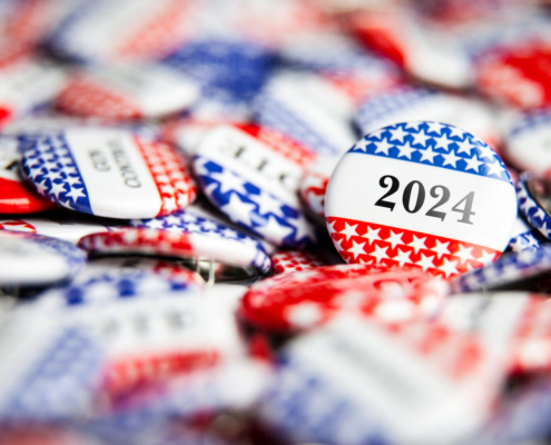 red, white and blue election buttons emblazoned with "2024"