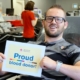 man in glasses with sign that says Proud blood donor