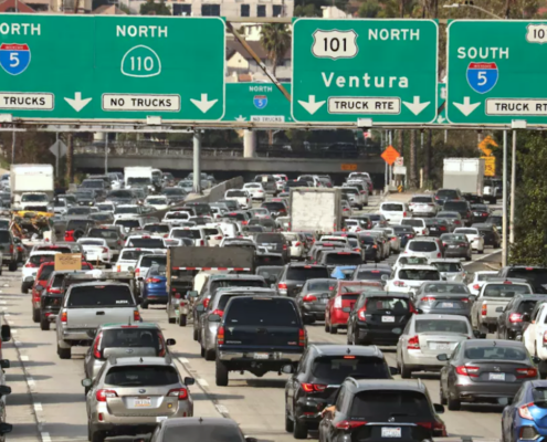 heavy traffic under freeway signs