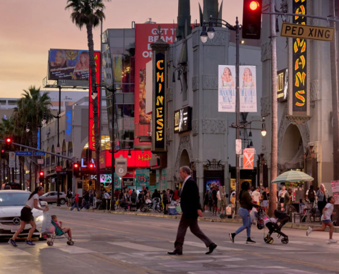 people cross a street in Hollywood