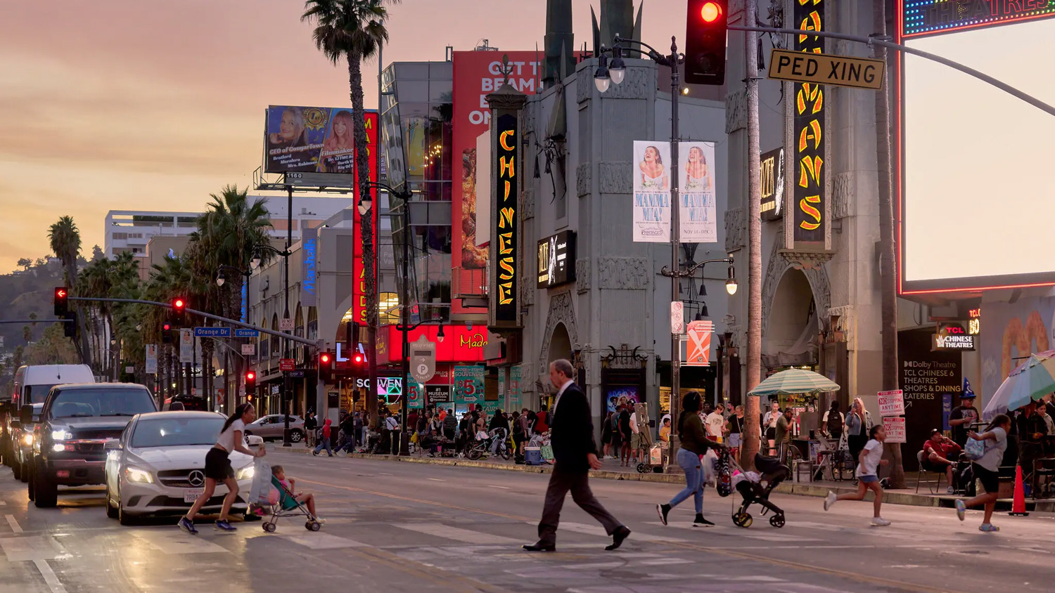 people cross a street in Hollywood