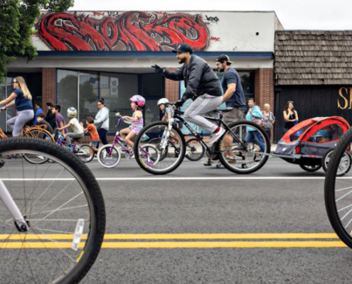 several people on bicycles on streets with bike lanes