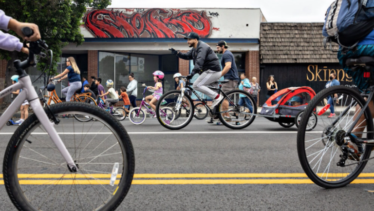 several people on bicycles on streets with bike lanes