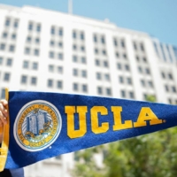 UCLA pennant in foreground, large white building in background